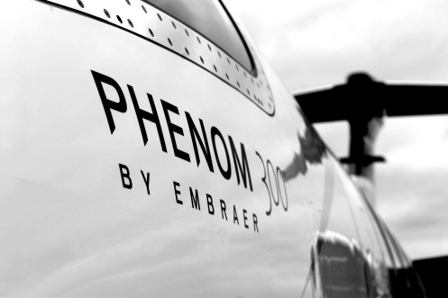 The nose of an Embraer Phenom 300, seen in this black-and-white capture. Over 100 have been built since the Phenom 300 was introduced in 2009.